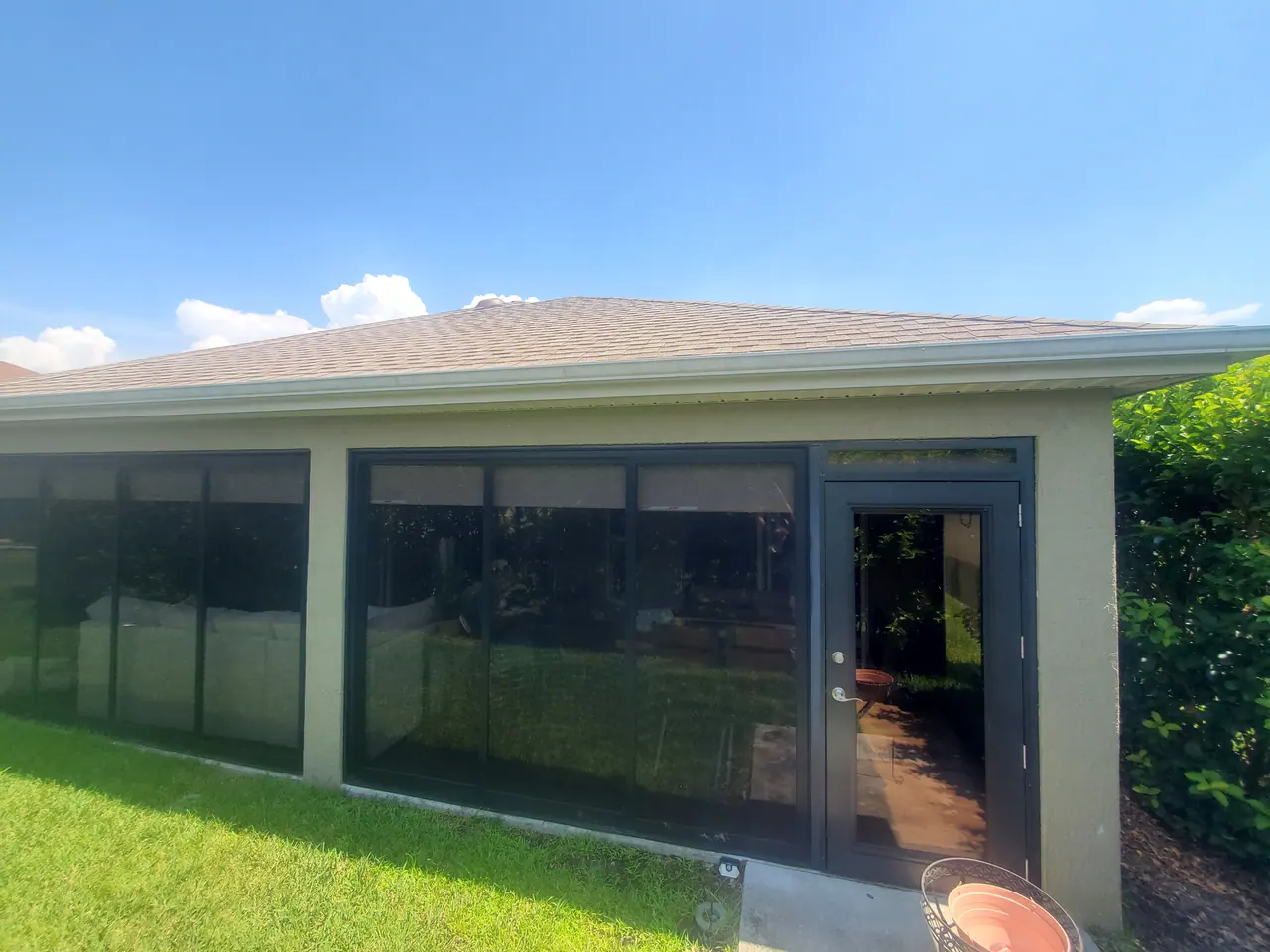The screened enclosure viewed from the lawn.