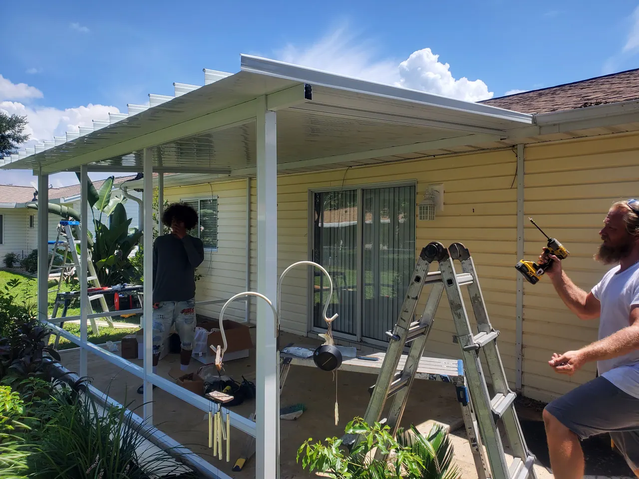 The patio cover and supporting posts during installation.